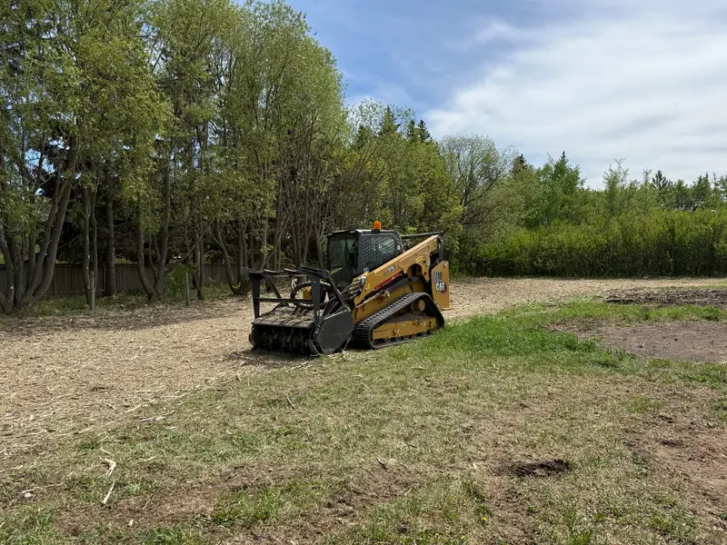 Tracked equipment on a cleared Central Alberta acreage